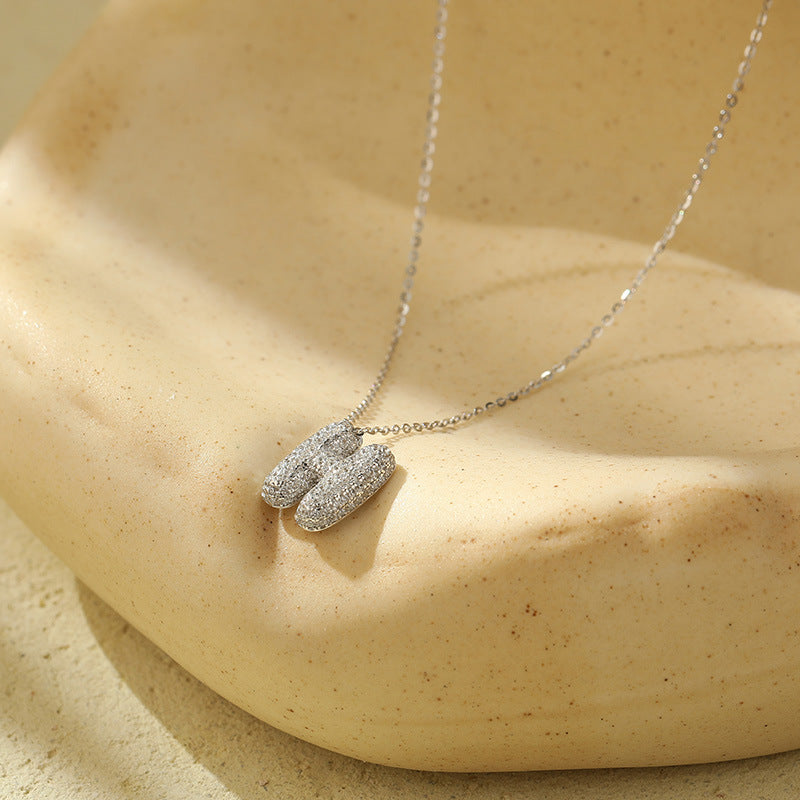 Fudus Stahl-Anhänger mit dicken Buchstaben