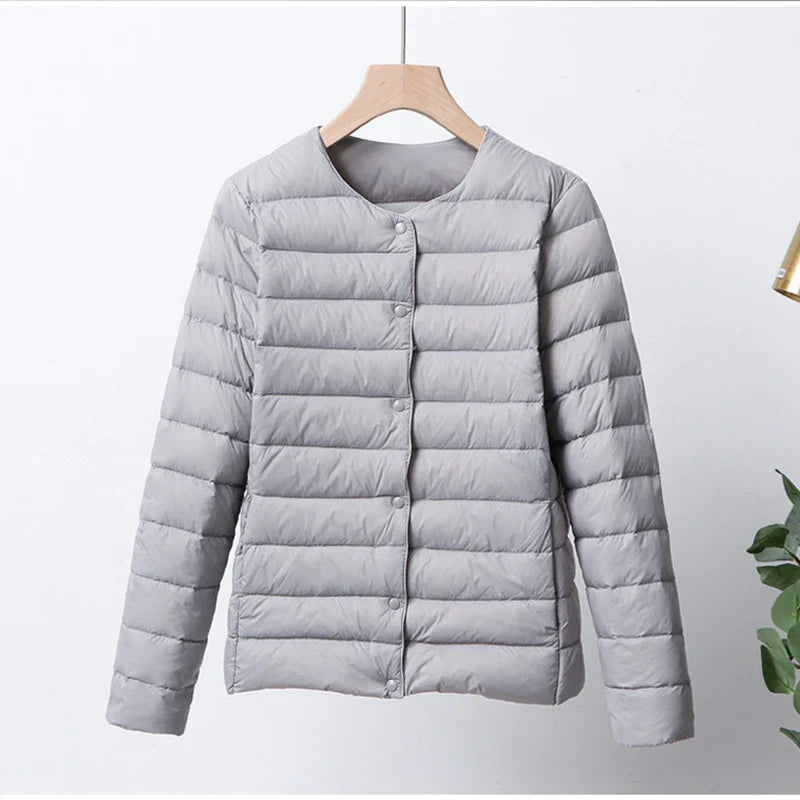 Krohn-e | Faltbare Pufferjacke mit Druckknopfverschluss