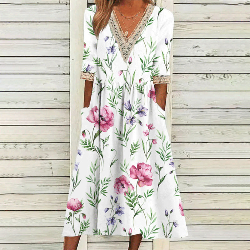 Elegantes Spitzenkleid mit V-Ausschnitt und Dreiviertelärmeln von Fudus