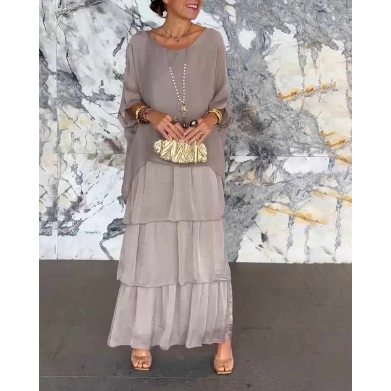 Elegantes langes Damenkleid mit Rundhalsausschnitt und Fledermausärmeln von Krohn-e