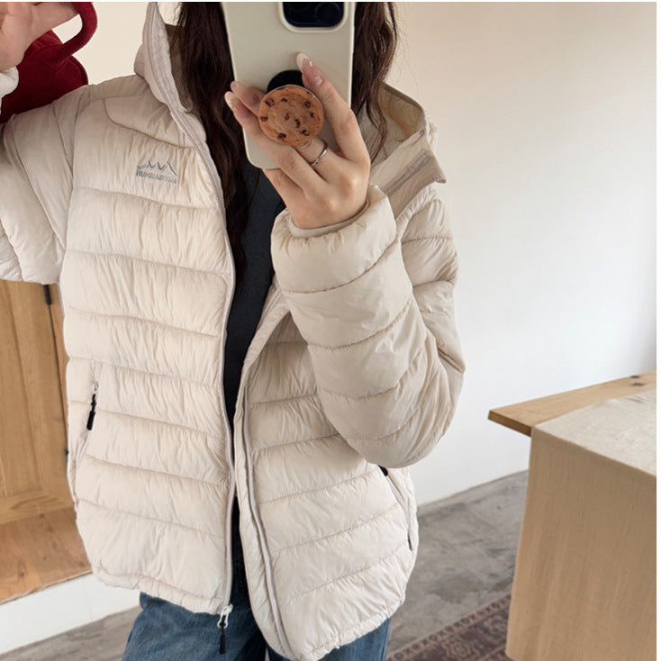 Damen ultraleichte Pufferjacke mit abnehmbarer Kapuze und elastischem Saum Krohn-e