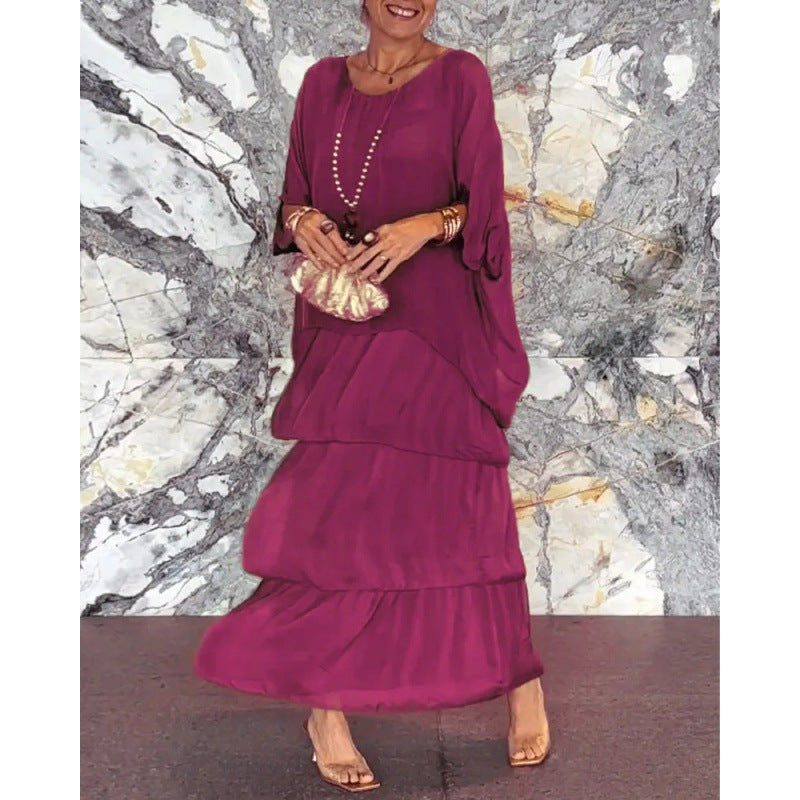 Elegantes langes Damenkleid mit Rundhalsausschnitt und Fledermausärmeln von Krohn-e