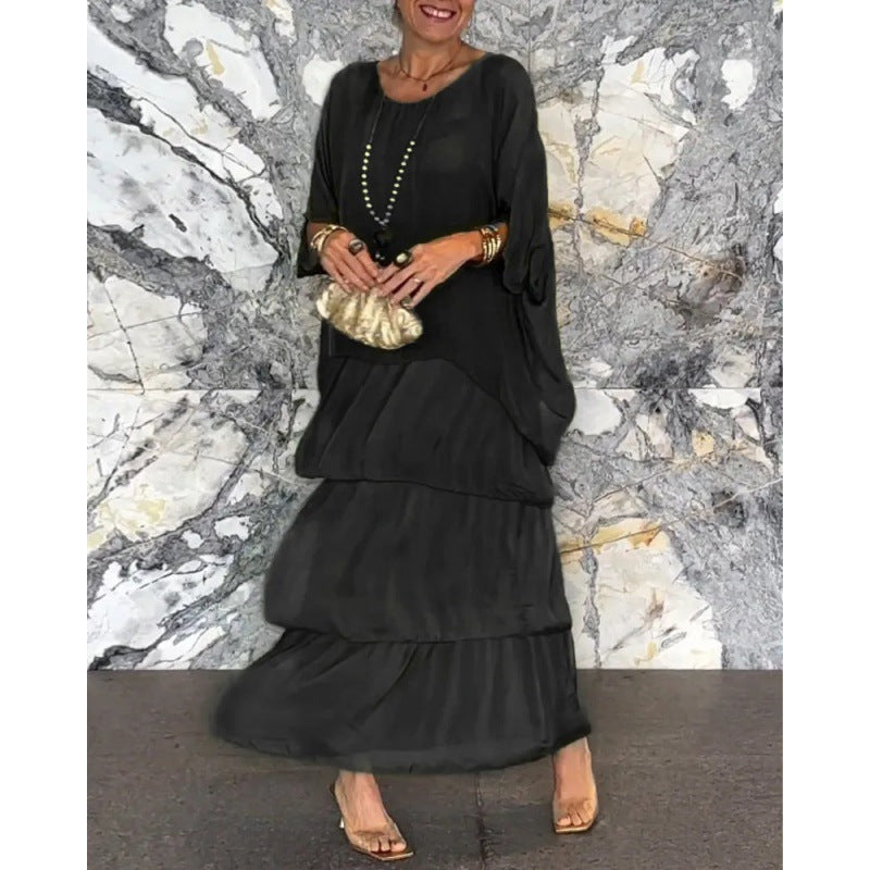 Elegantes langes Damenkleid mit Rundhalsausschnitt und Fledermausärmeln von Krohn-e