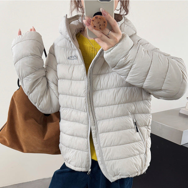 Damen ultraleichte Pufferjacke mit abnehmbarer Kapuze und elastischem Saum Krohn-e